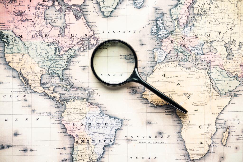 world with magnifying glass